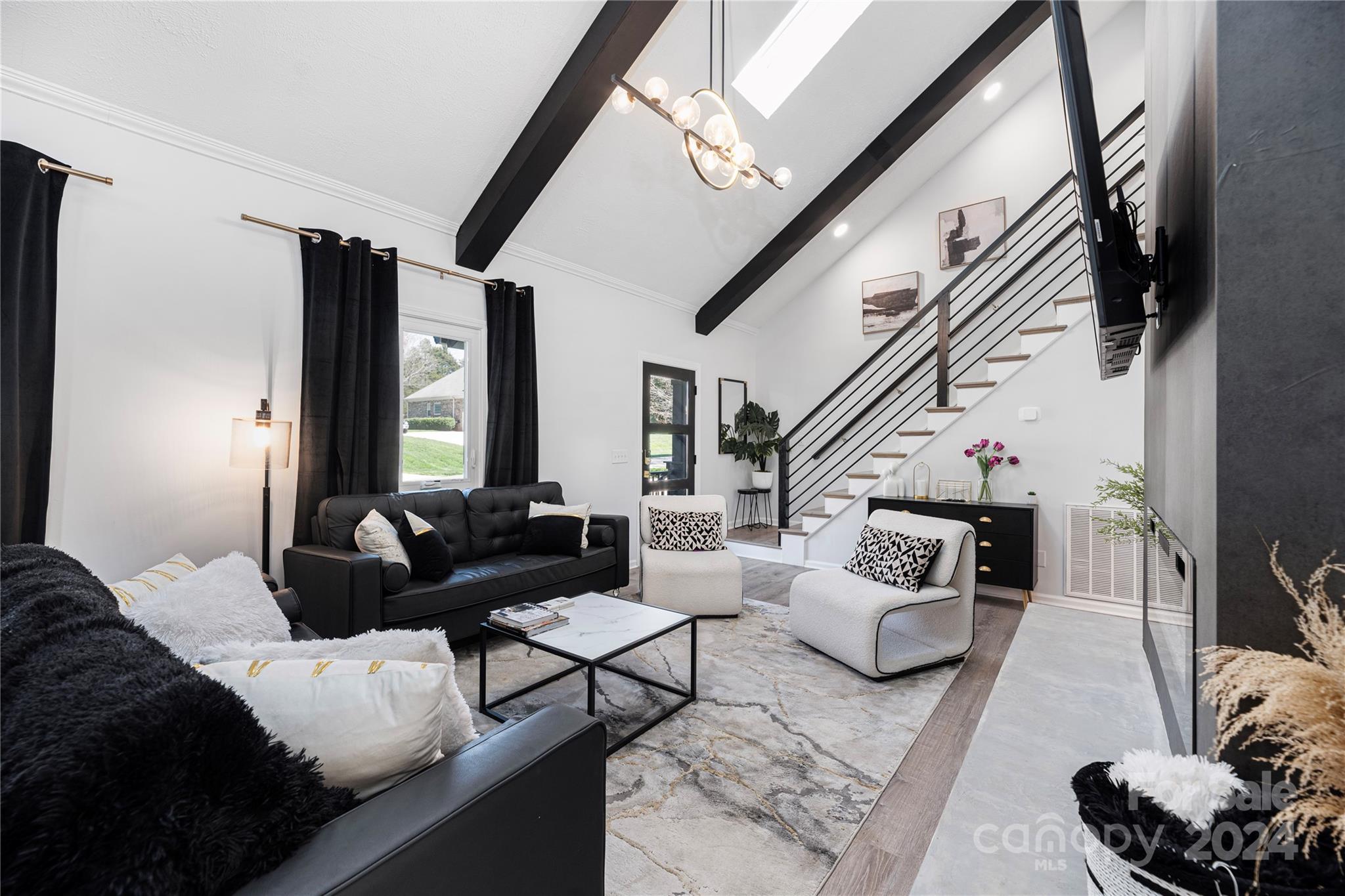 262 Spring Run Road Mooresville, NC 28117 - Photo 6 of 48 a living room with furniture and a flat screen tv