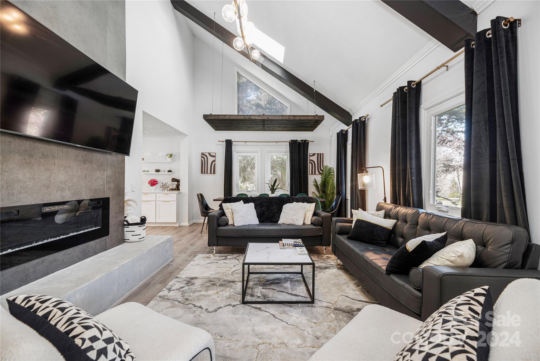 262 Spring Run Road Mooresville, NC 28117 - Photo 7 of 48 a living room with furniture a flat screen tv and a fireplace