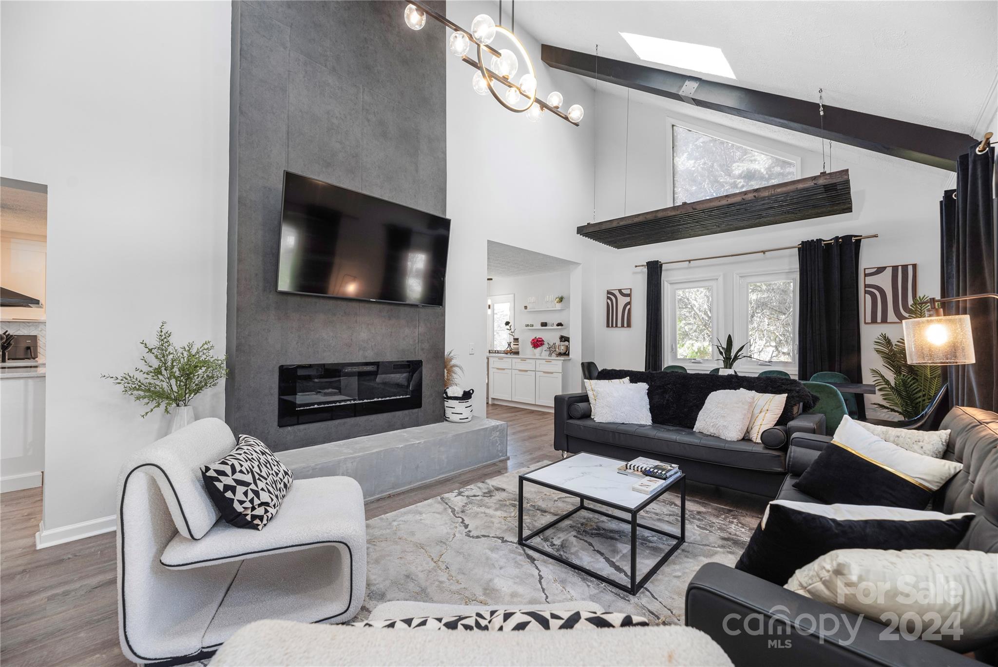 262 Spring Run Road Mooresville, NC 28117 - Photo 8 of 48 a living room with furniture a flat screen tv and a fireplace