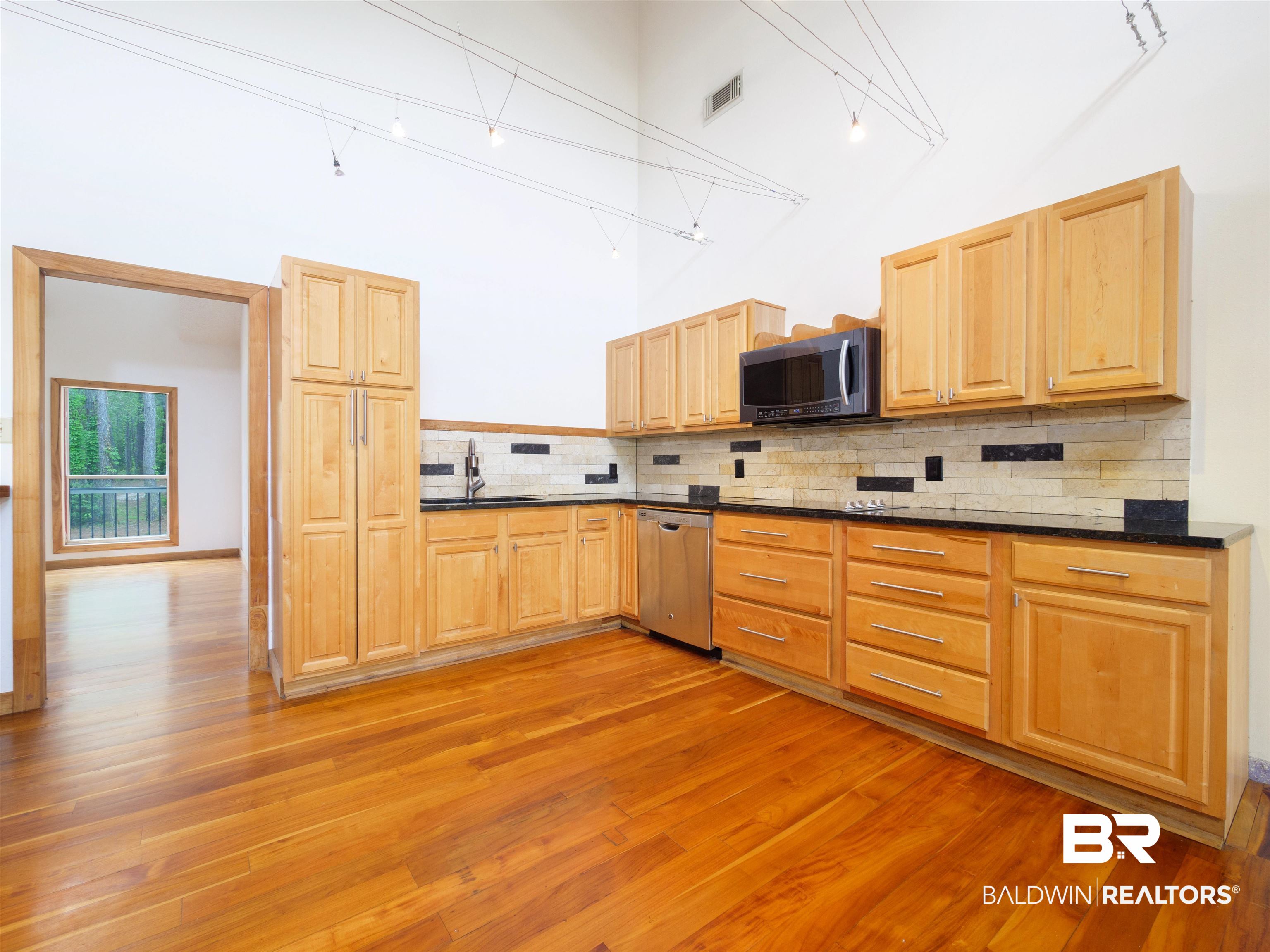 12831 Clay City Road Fairhope, AL 36532 - Photo 13 of 47 Clean line cabinets with granite counters
