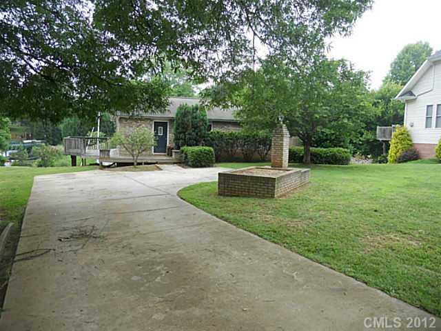 301 Commodore Loop Mooresville, NC 28117 - Photo 2 of 16 a view of a house with backyard and a tree