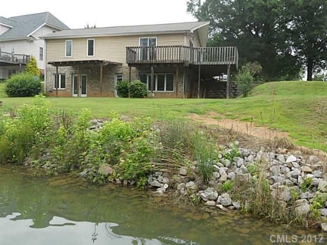 301 Commodore Loop Mooresville, NC 28117 - Photo 16 of 16 a view of a house with a yard