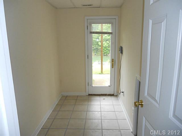 301 Commodore Loop Mooresville, NC 28117 - Photo 8 of 16 a view of an empty room and window