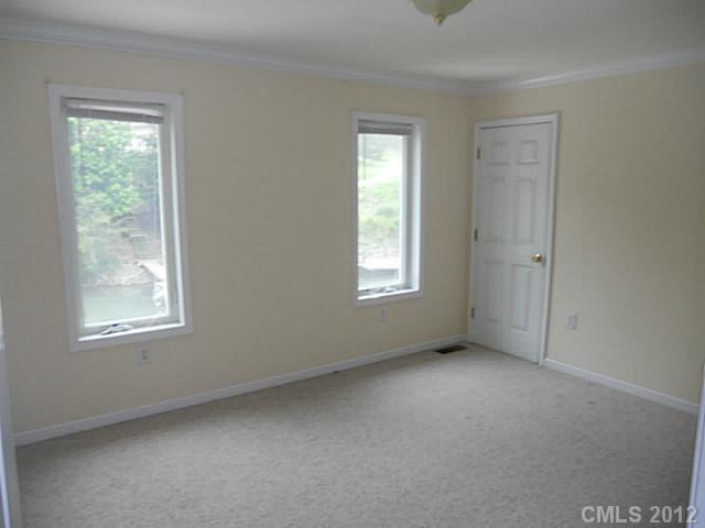 301 Commodore Loop Mooresville, NC 28117 - Photo 9 of 16 an empty room with windows