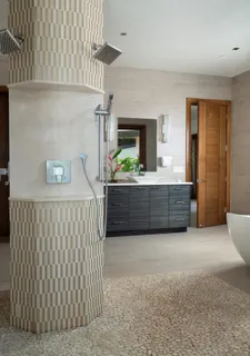 a spacious bathroom with a bathtub and sink