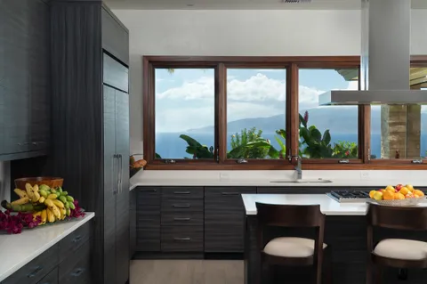 a view of a sink and a table in a kitchen