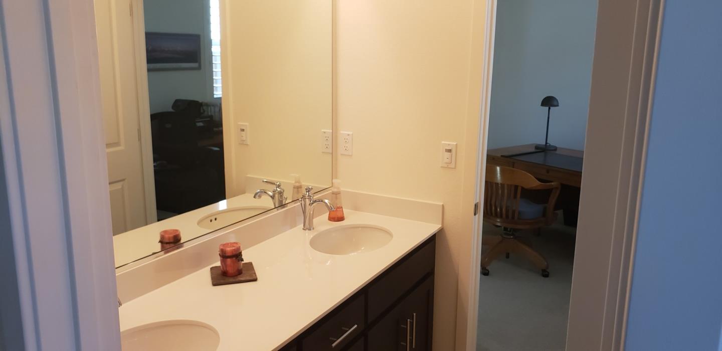 931 Puma Way Gilroy, CA 95020 - Photo 13 of 27 a bathroom with a sink and a mirror