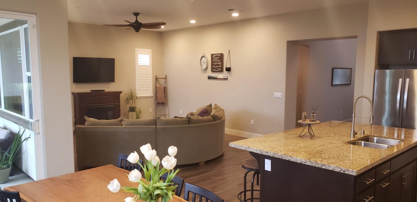 931 Puma Way Gilroy, CA 95020 - Photo 4 of 27 a living room with furniture and a flat screen tv