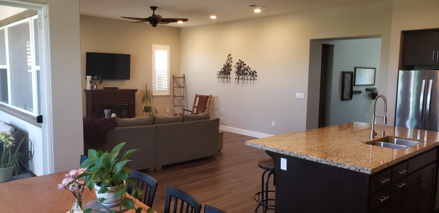 931 Puma Way Gilroy, CA 95020 - Photo 6 of 27 a living room with furniture and a flat screen tv