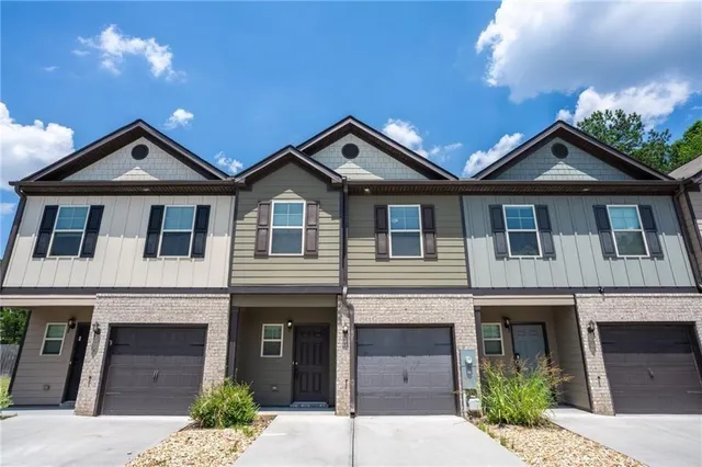 a front view of a house with yard