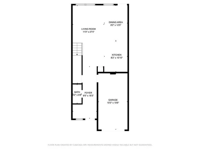 a picture of a bench in front of a wall