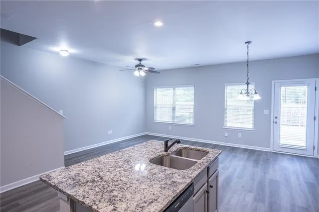 a kitchen with sink and window