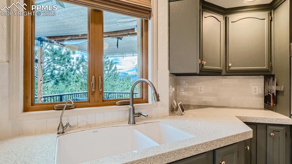 65 Pontiac Loop Monument, CO 80132 - Photo 17 of 49 a bathroom with a granite countertop sink and a vanity