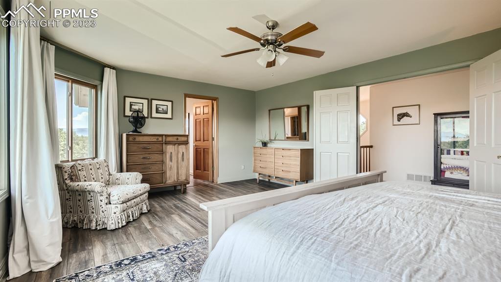 65 Pontiac Loop Monument, CO 80132 - Photo 31 of 49 a bedroom with a bed couches and fireplace