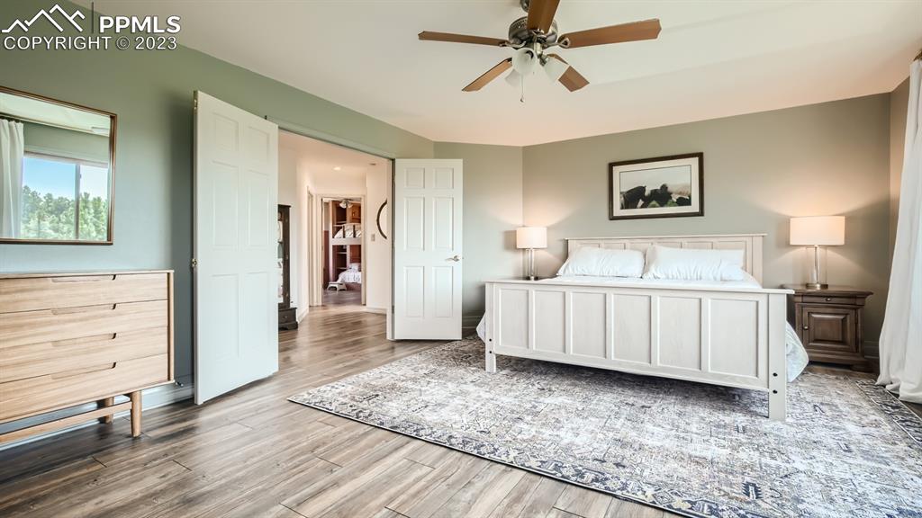 65 Pontiac Loop Monument, CO 80132 - Photo 32 of 49 a bedroom with a bed and a view of kitchen
