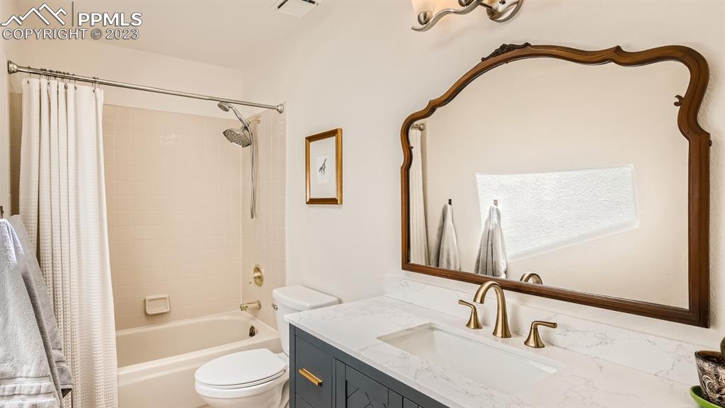 65 Pontiac Loop Monument, CO 80132 - Photo 35 of 49 a bathroom with a granite countertop sink toilet and shower