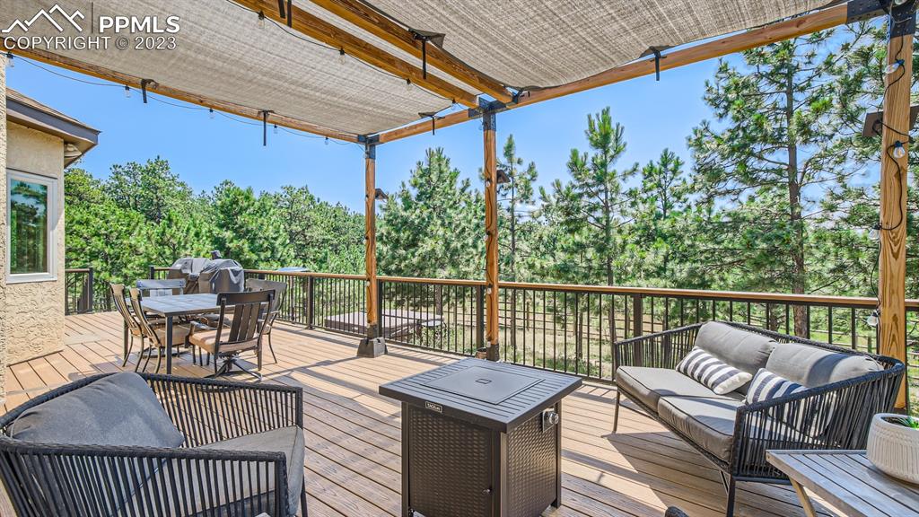 65 Pontiac Loop Monument, CO 80132 - Photo 36 of 49 a roof deck with a table and chairs