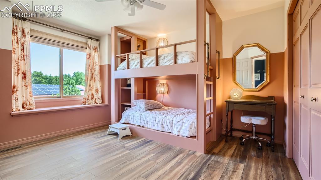 65 Pontiac Loop Monument, CO 80132 - Photo 37 of 49 a bedroom with a bed a mirror on desk and a window