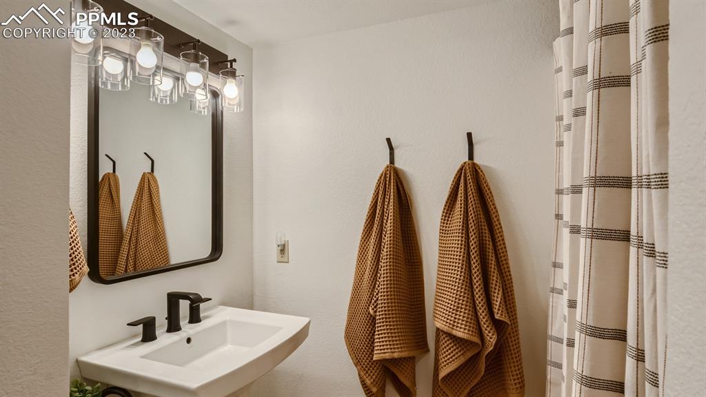 65 Pontiac Loop Monument, CO 80132 - Photo 40 of 49 a bathroom with a sink and a mirror