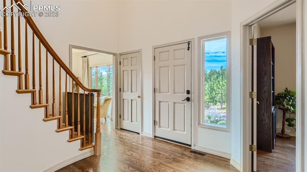 65 Pontiac Loop Monument, CO 80132 - Photo 9 of 49 a view of an entryway with wooden floor