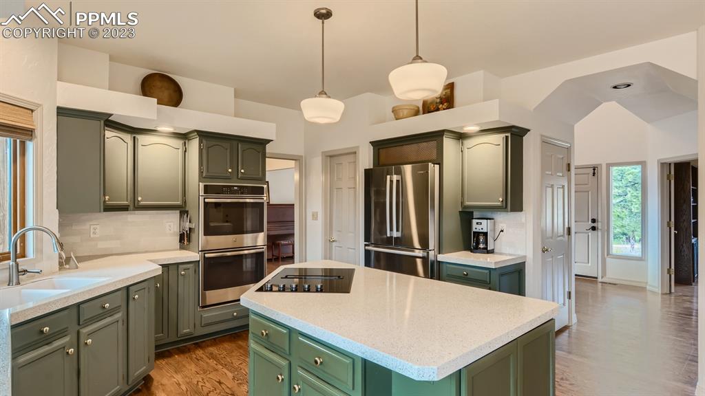 65 Pontiac Loop Monument, CO 80132 - Photo 10 of 49 a kitchen with a refrigerator a sink and dishwasher