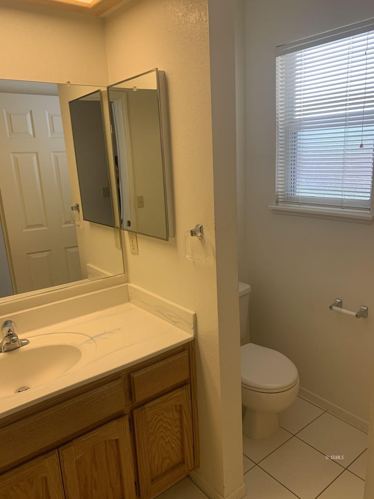 328 Ashton Street Ridgecrest, CA 93555 - Photo 19 of 28 a bathroom with a sink a toilet and shower