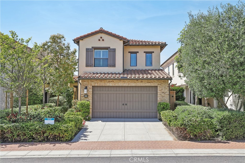 front view of a house with a garden