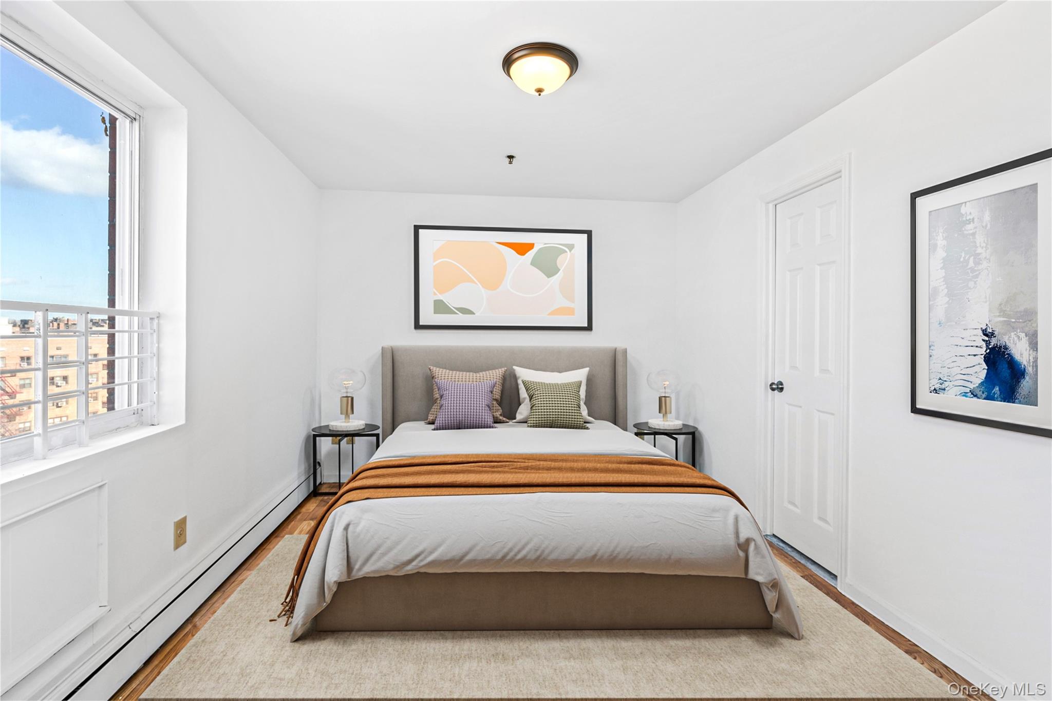 136-16 31st Road, Unit 8B Queens, NY 11354 - Photo 11 of 23 Virtual Staged Bedroom with a baseboard heating unit, multiple windows, wood finished floors, and baseboards