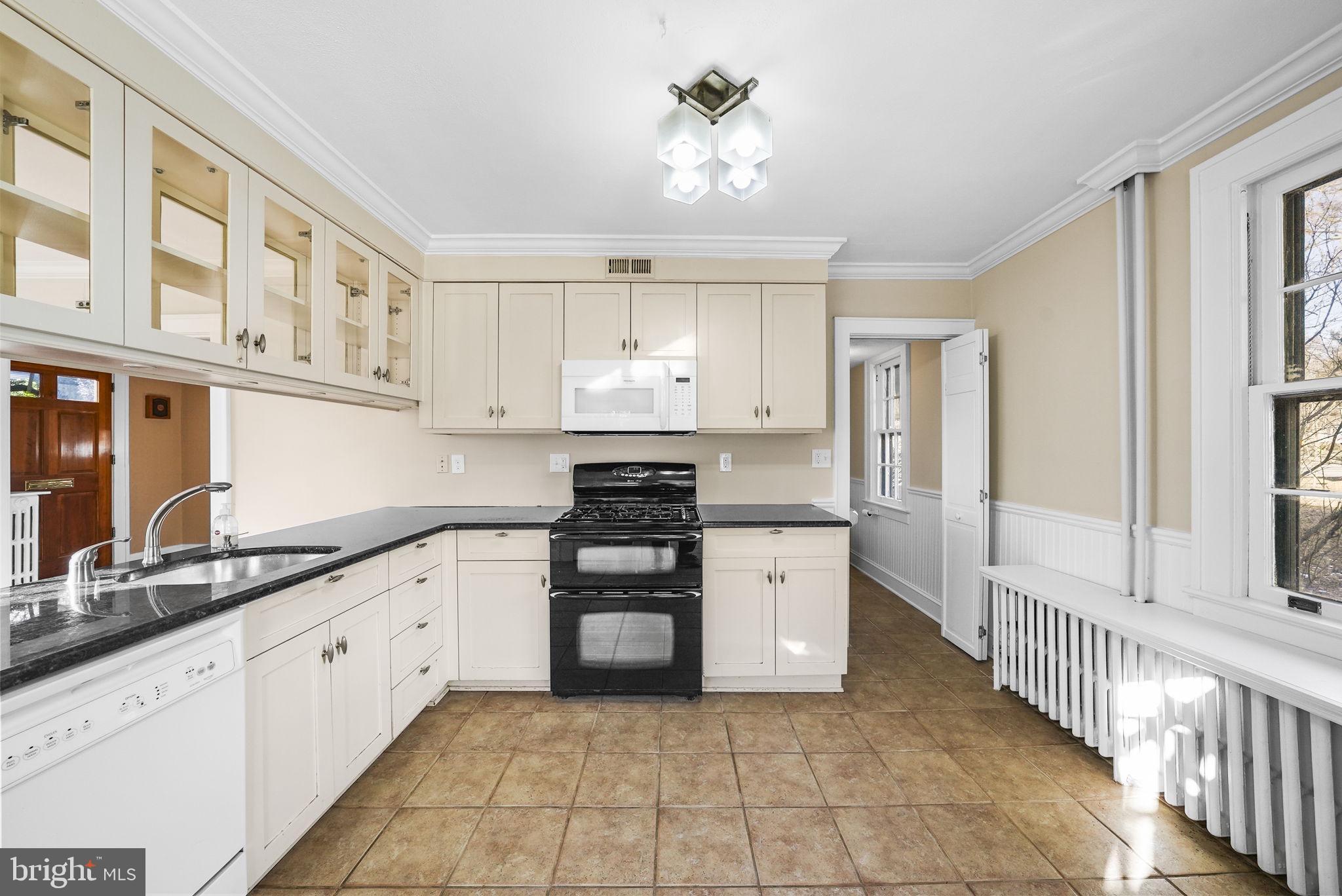 2046 Pennington Road Ewing, NJ 08618 - Photo 12 of 37 a kitchen with stainless steel appliances a stove a sink and a refrigerator