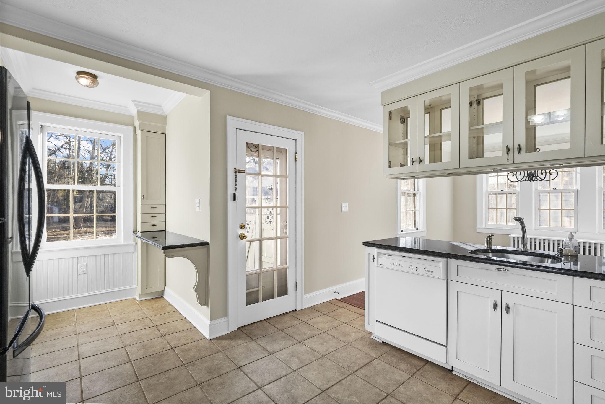2046 Pennington Road Ewing, NJ 08618 - Photo 14 of 37 a view of a kitchen from the living room and windows
