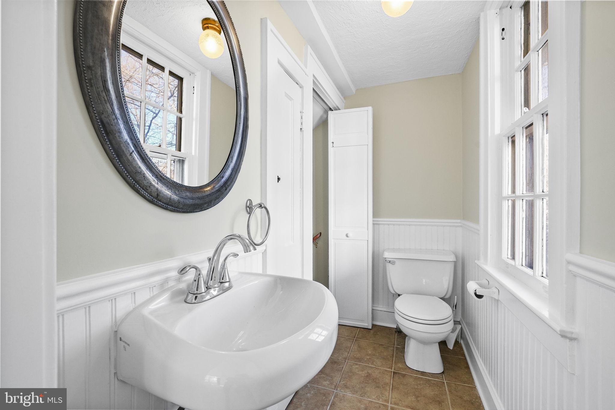 2046 Pennington Road Ewing, NJ 08618 - Photo 16 of 37 a bathroom with a sink and a mirror