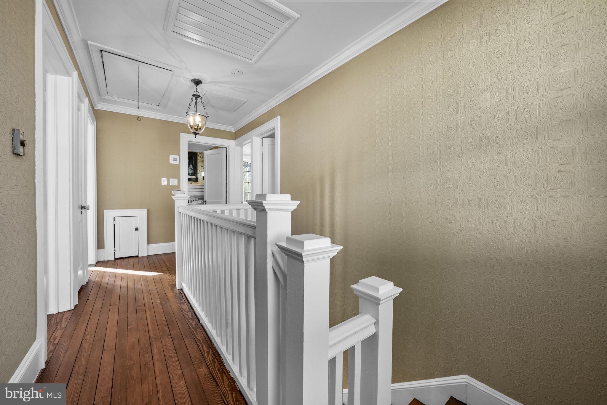2046 Pennington Road Ewing, NJ 08618 - Photo 22 of 37 a view of a hallway with wooden floor
