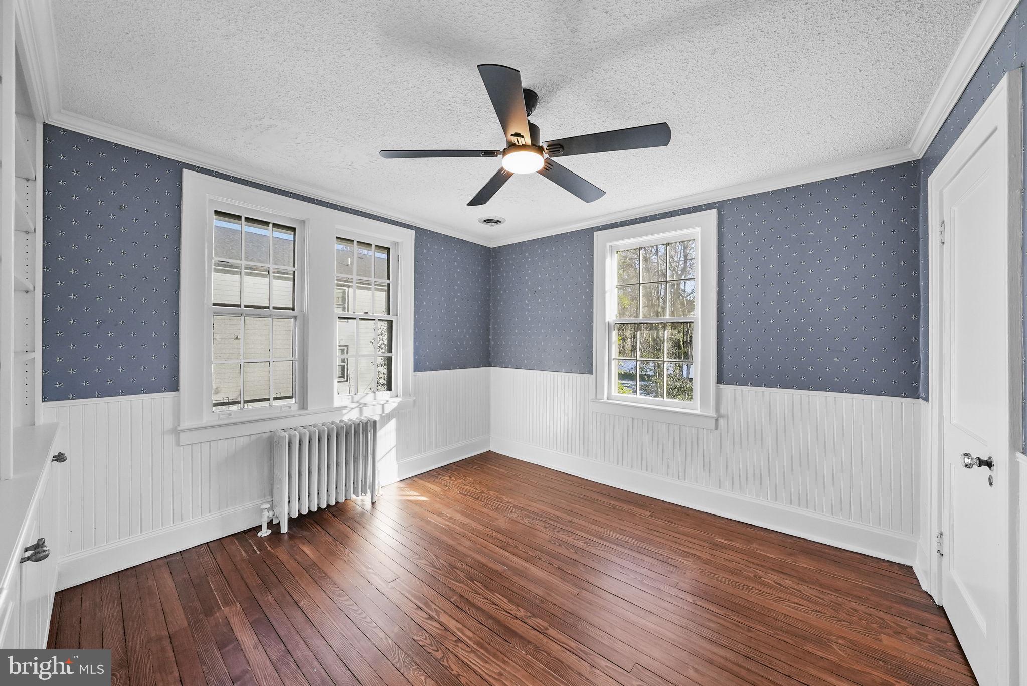 2046 Pennington Road Ewing, NJ 08618 - Photo 23 of 37 a view of an empty room with wooden floor and a window