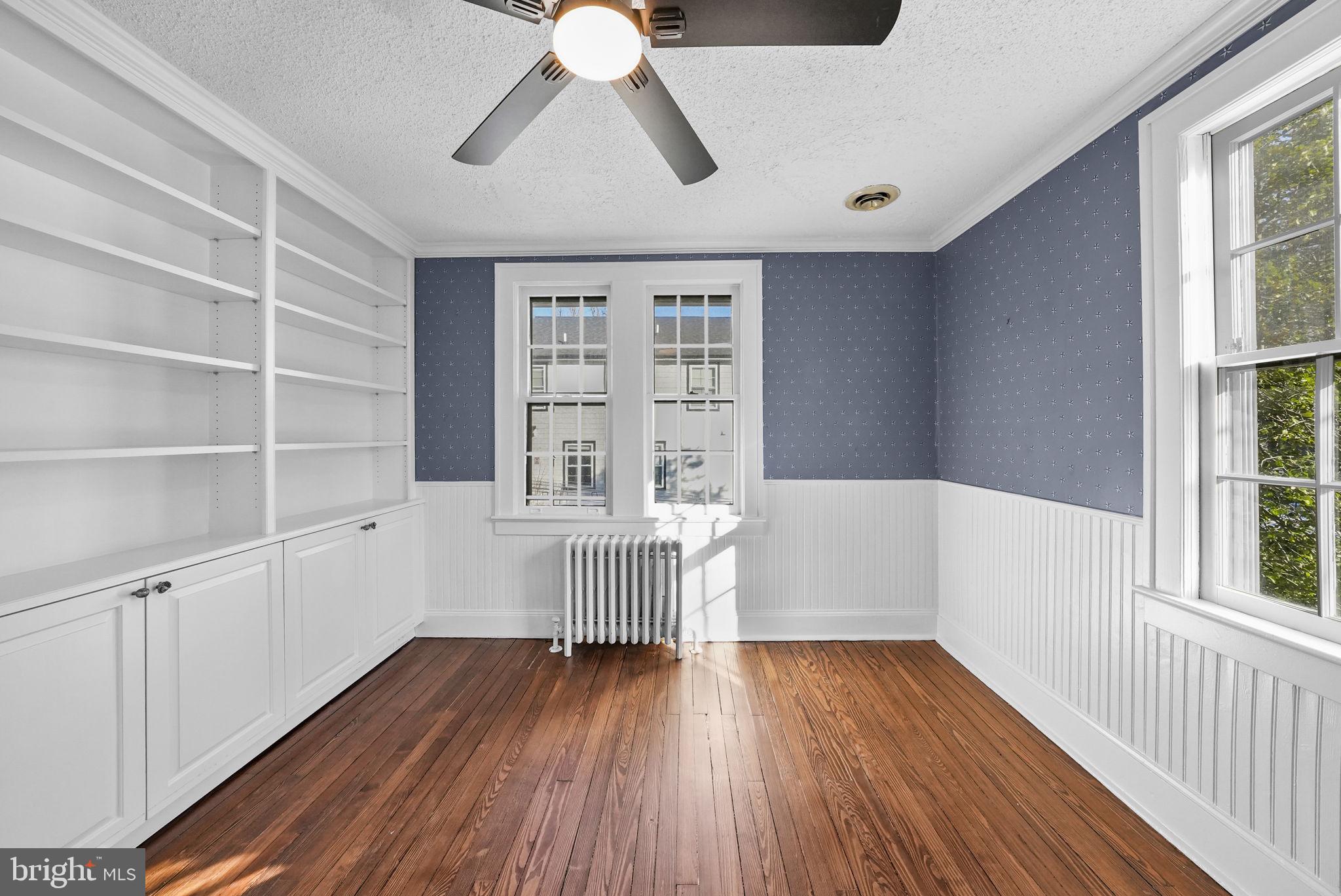 2046 Pennington Road Ewing, NJ 08618 - Photo 24 of 37 a view of an empty room with a window and wooden floor
