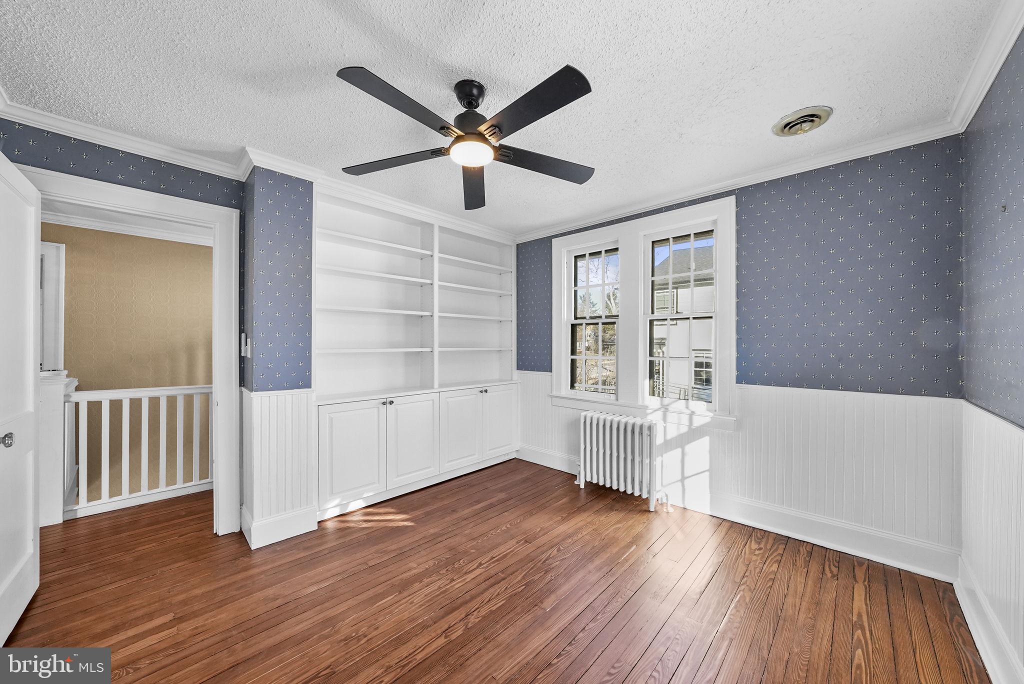 2046 Pennington Road Ewing, NJ 08618 - Photo 25 of 37 a view of an empty room with a window and wooden floor