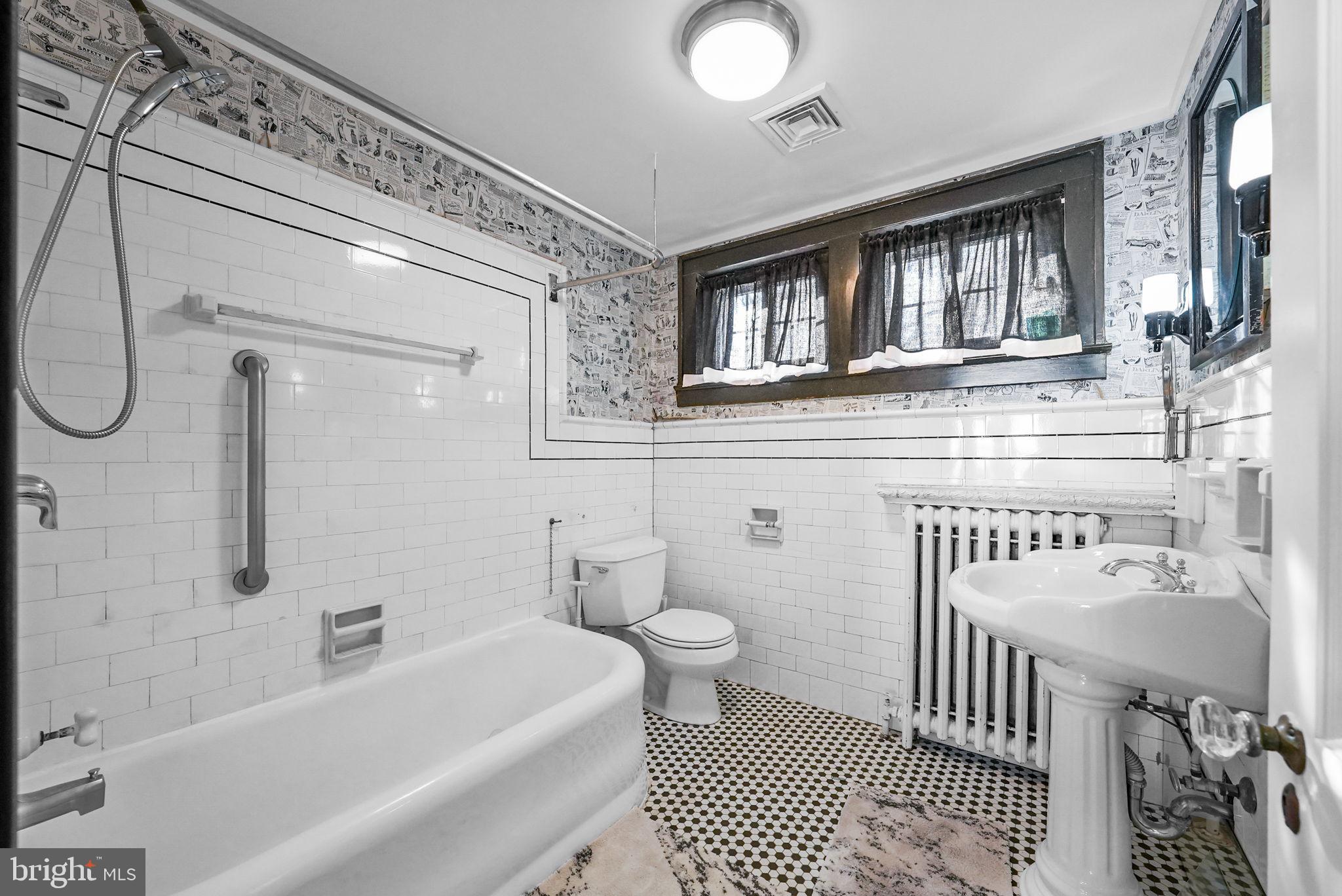 2046 Pennington Road Ewing, NJ 08618 - Photo 28 of 37 a bathroom with a sink a toilet and shower