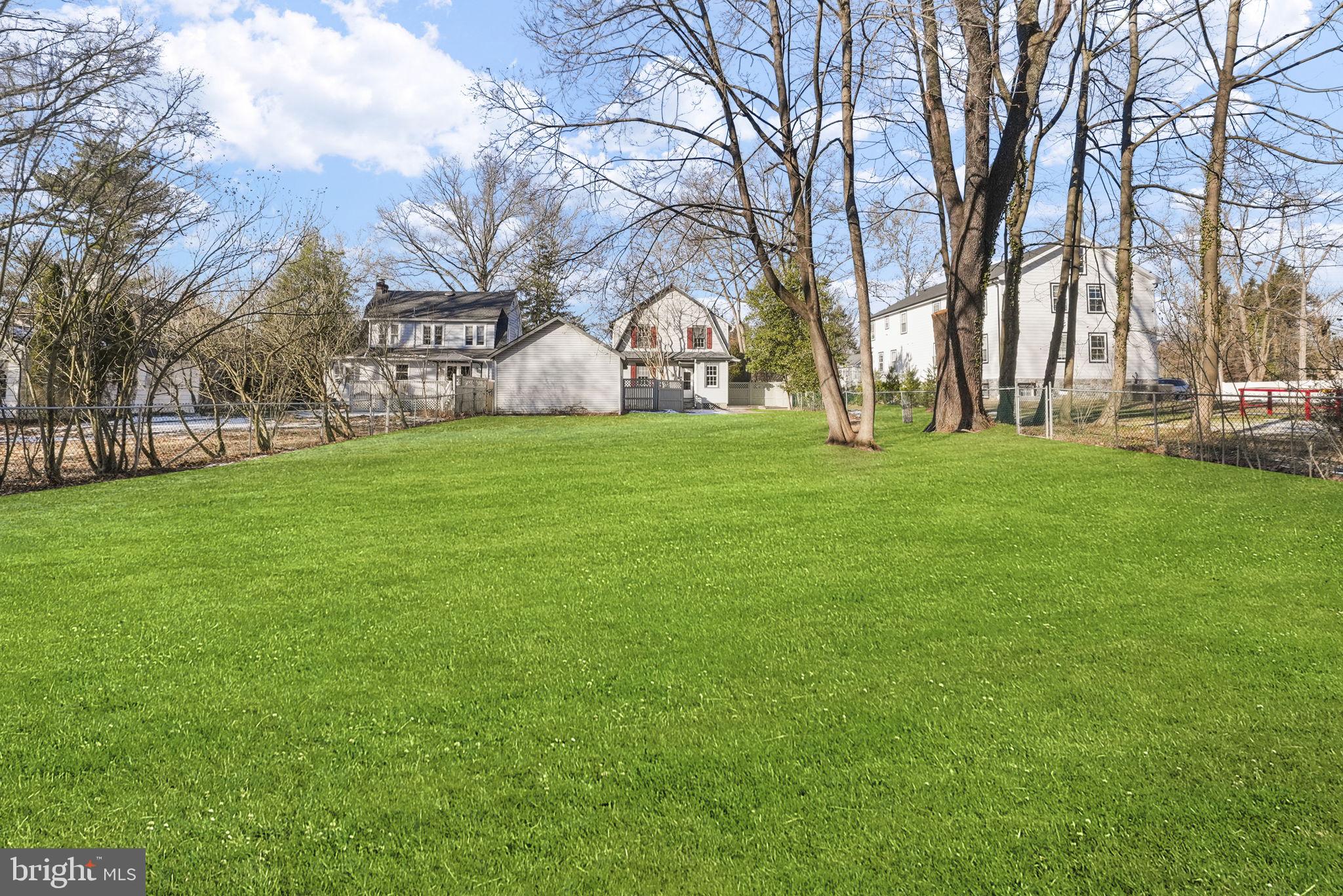 2046 Pennington Road Ewing, NJ 08618 - Photo 35 of 37 a backyard of a house with lots of green space and fountain