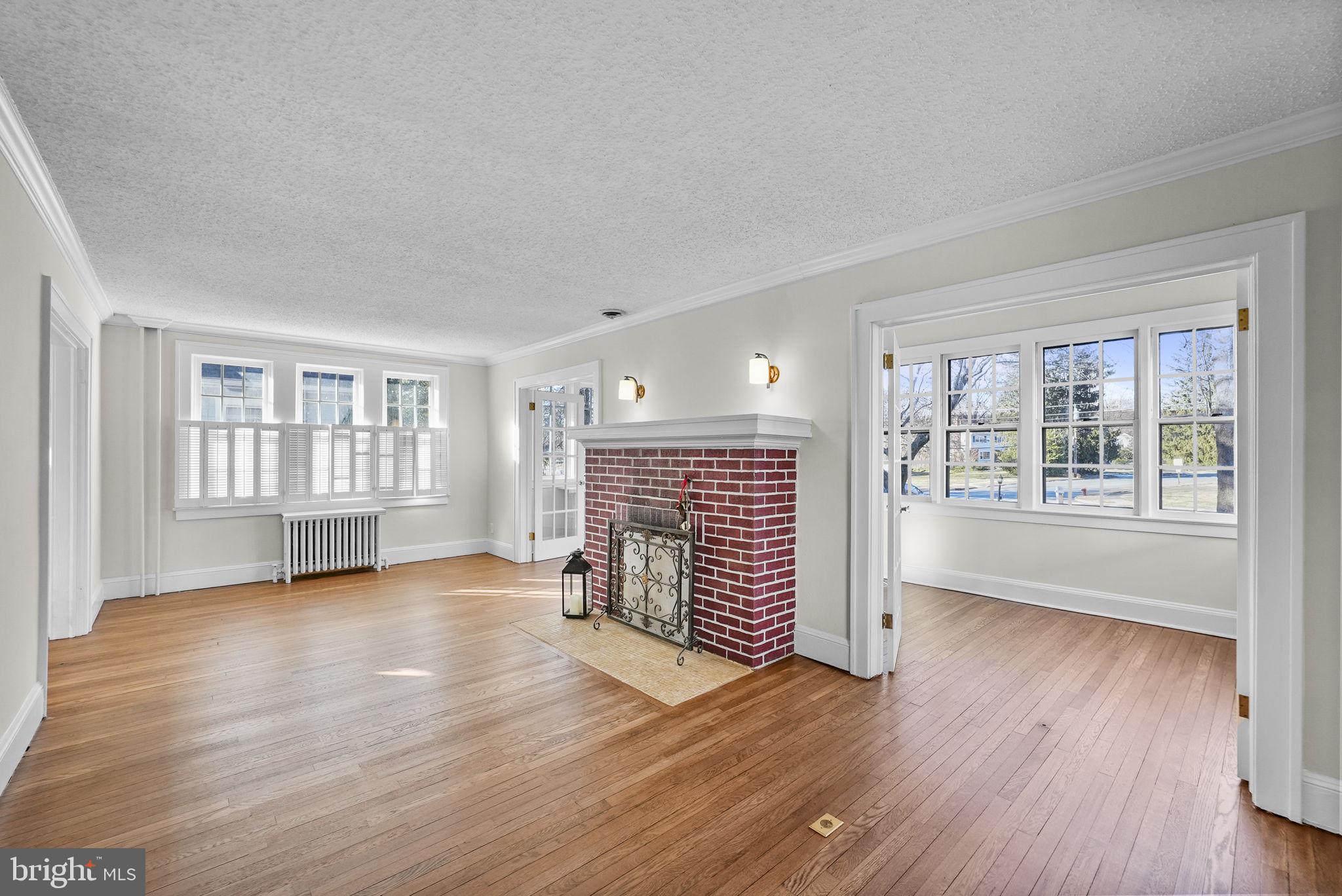 2046 Pennington Road Ewing, NJ 08618 - Photo 4 of 37 wooden floor in an empty room with a window