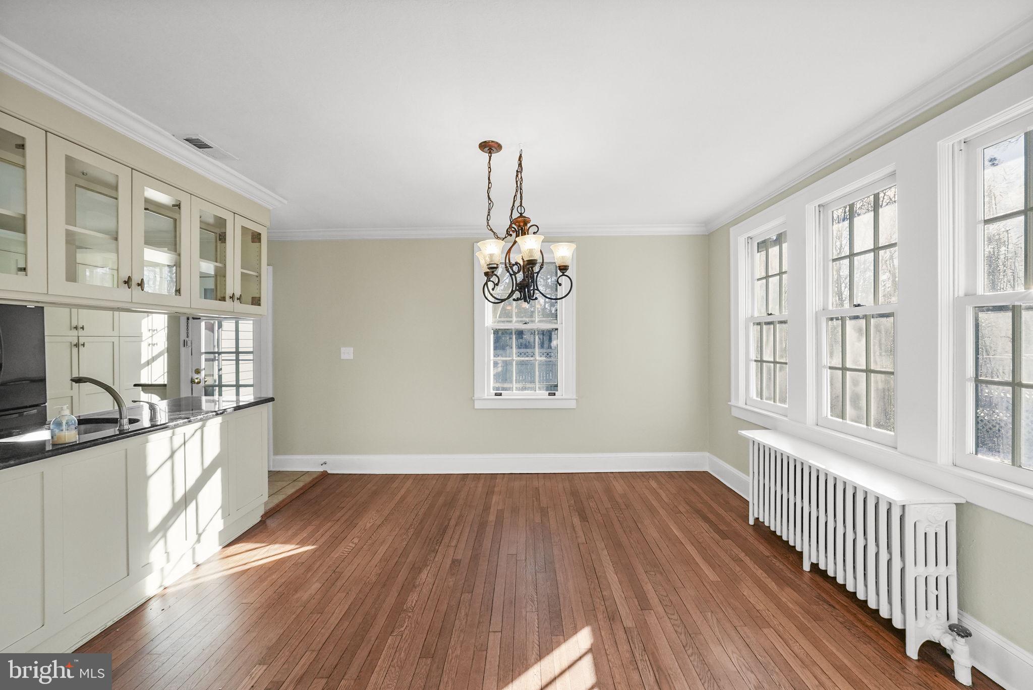 2046 Pennington Road Ewing, NJ 08618 - Photo 10 of 37 wooden floor in an empty room with a window