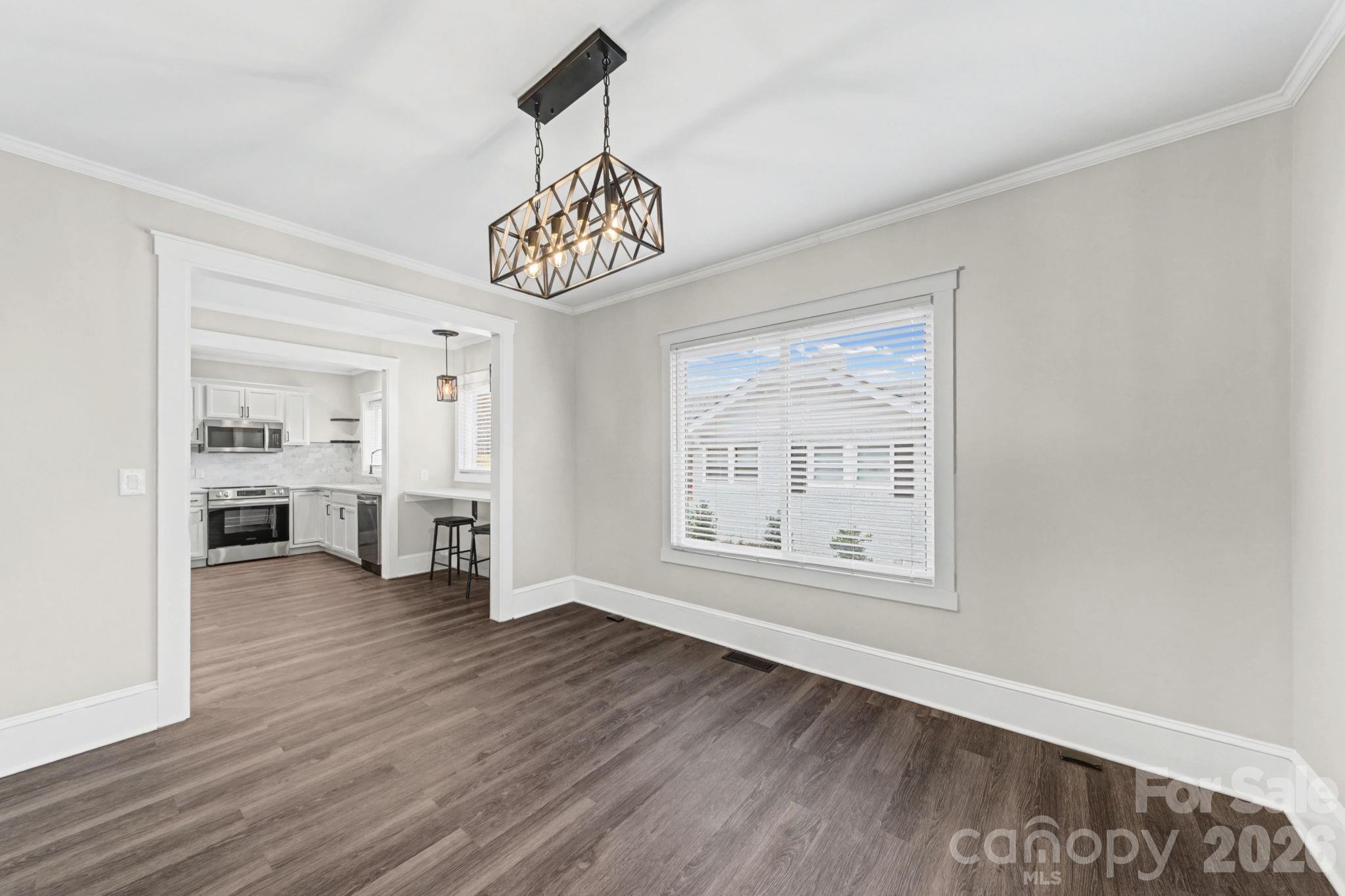 1132 East Main Street Albemarle, NC 28001 - Photo 11 of 25 a view of an empty room with a window