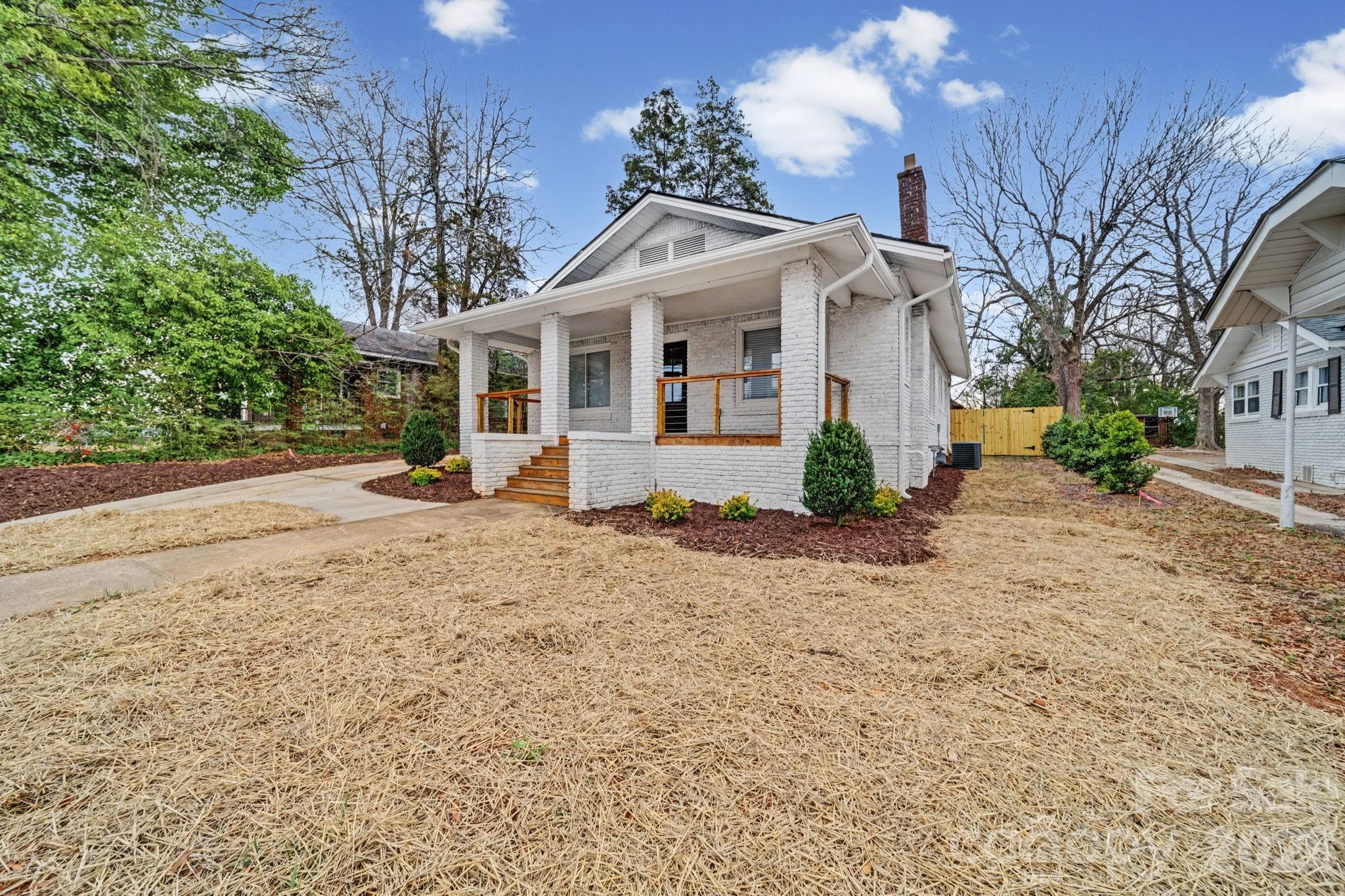 1132 East Main Street Albemarle, NC 28001 - Photo 2 of 25 a front view of a house with garden