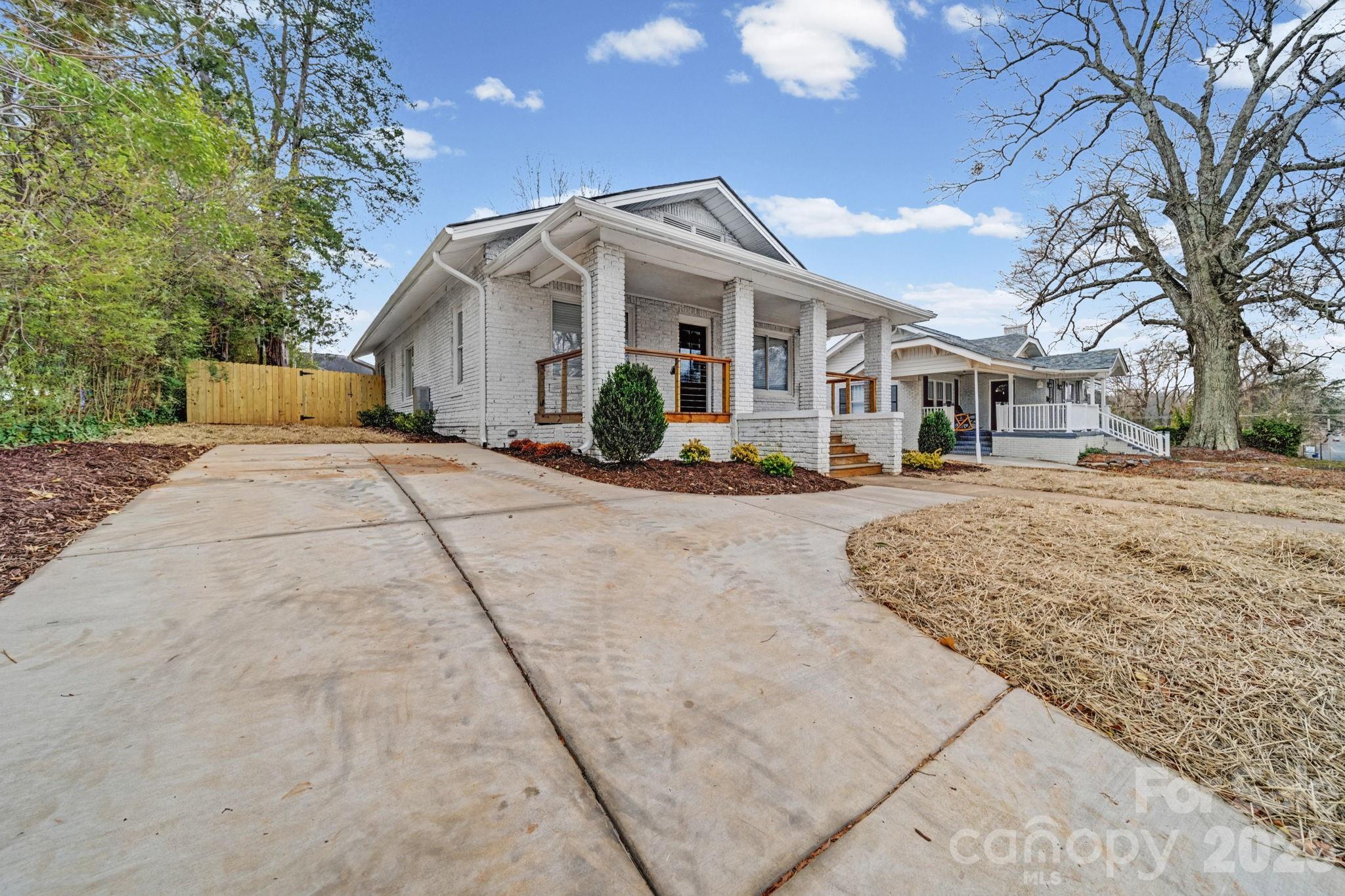 1132 East Main Street Albemarle, NC 28001 - Photo 3 of 25 a front view of a house with a yard