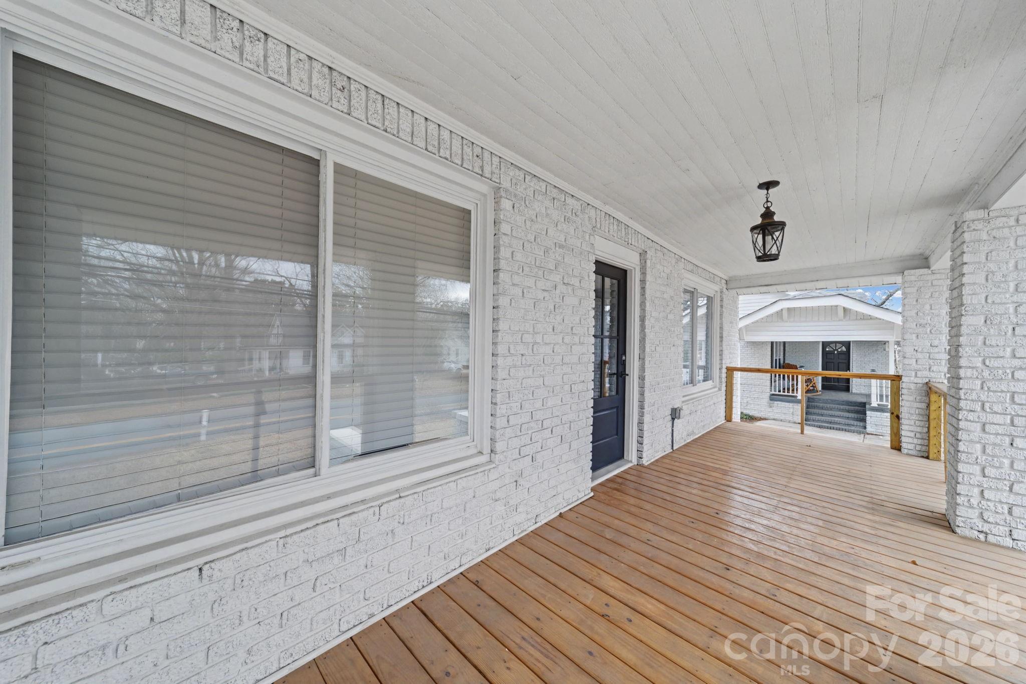 1132 East Main Street Albemarle, NC 28001 - Photo 7 of 25 a living room with furniture and a table