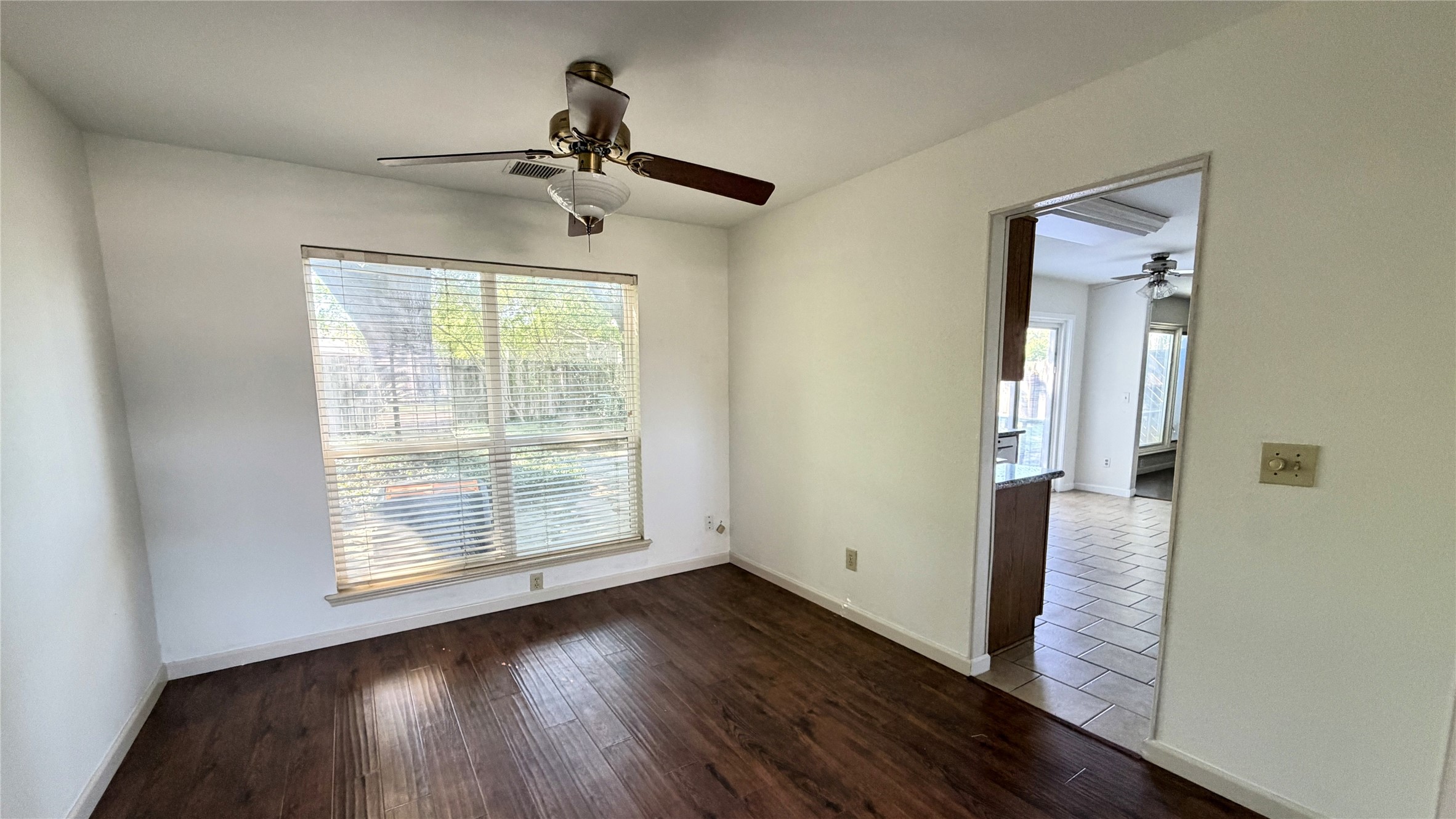 7771 Springville Drive Houston, TX 77095 - Photo 5 of 13 Bright dining area with scenic backyard views and seamless kitchen access.