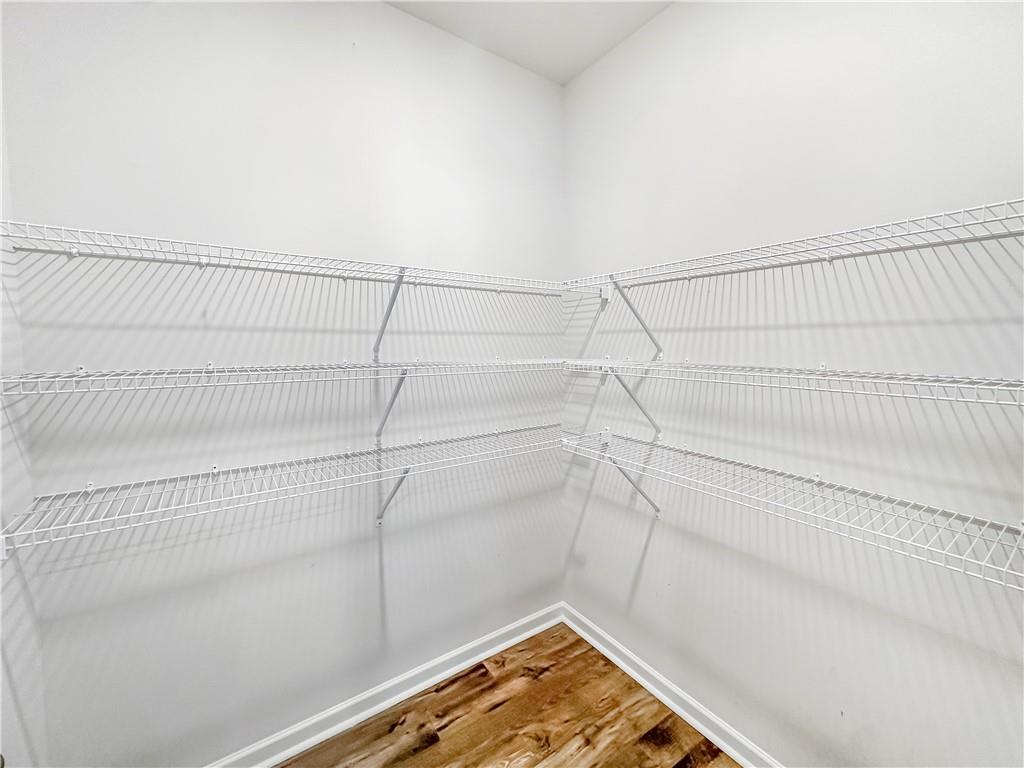 965 Athena Bend Fairburn, GA 30213 - Photo 22 of 37 a view of a room with racks on the wall