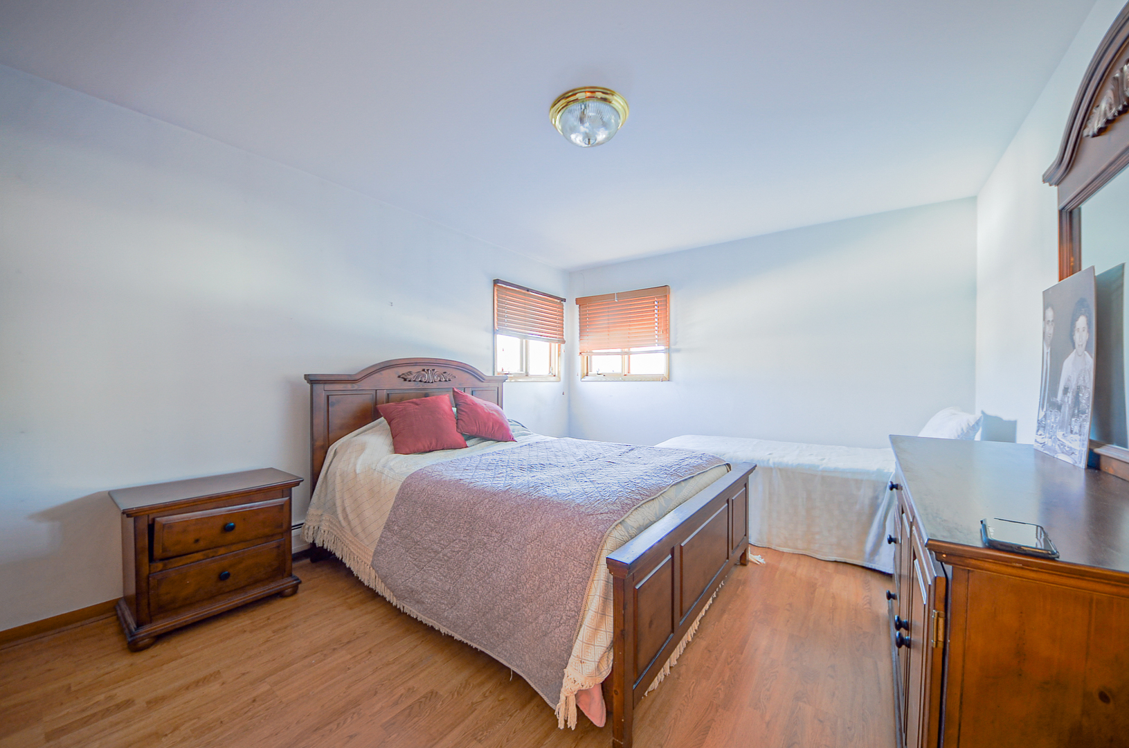 8216 West Belmont Avenue, Unit 2N Chicago, IL 60634 - Photo 9 of 11 a bedroom with a bed and a window
