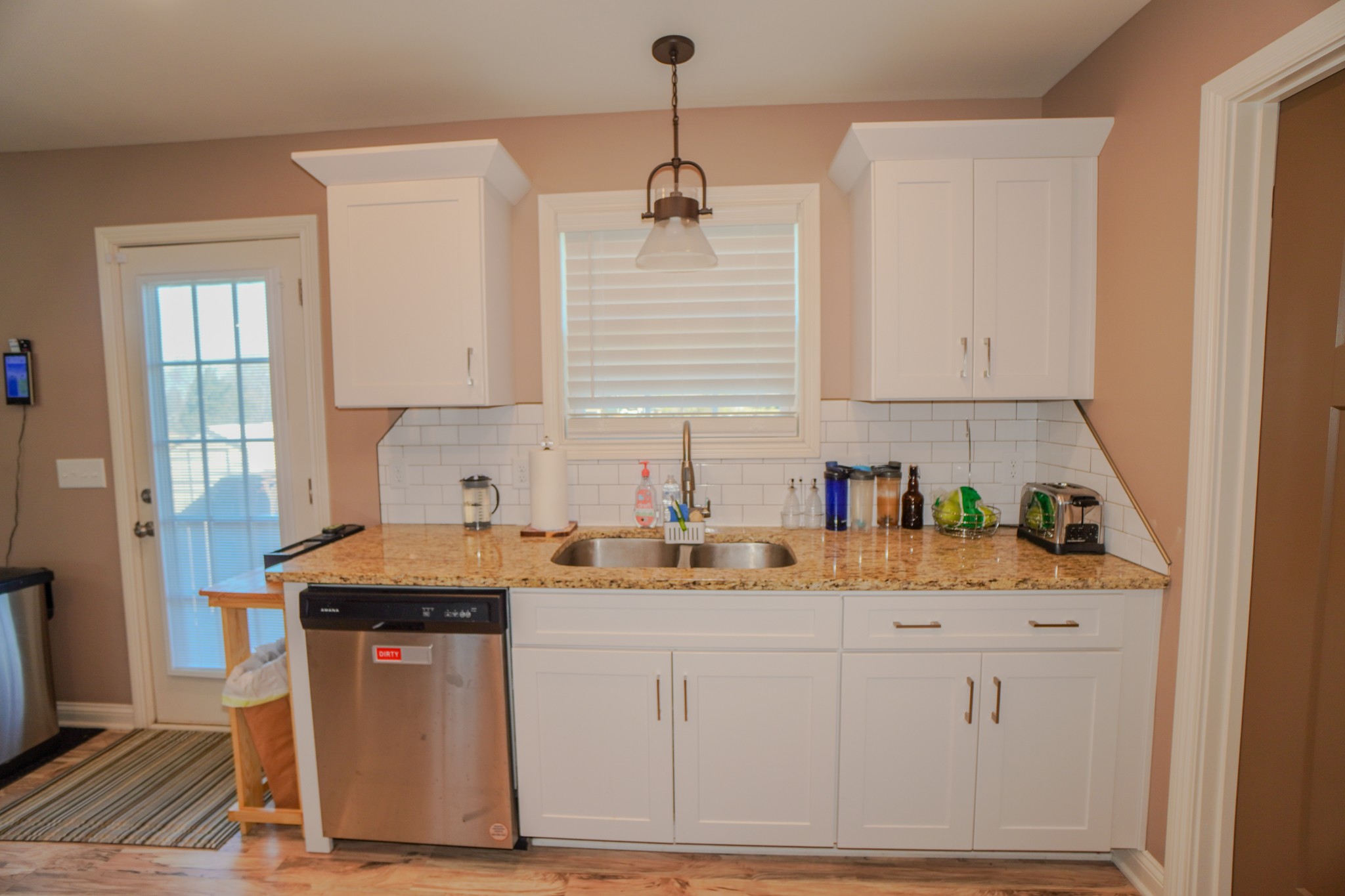 451 James Whitefield Road Bethpage, TN 37022 - Photo 23 of 52 a kitchen with stainless steel appliances granite countertop a sink stove and cabinets