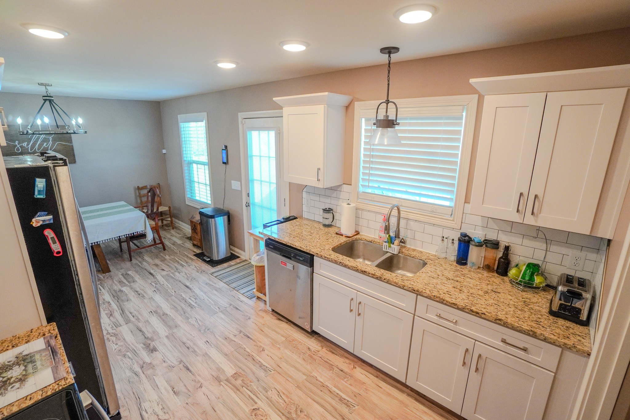 451 James Whitefield Road Bethpage, TN 37022 - Photo 25 of 52 a kitchen with sink cabinets and wooden floor