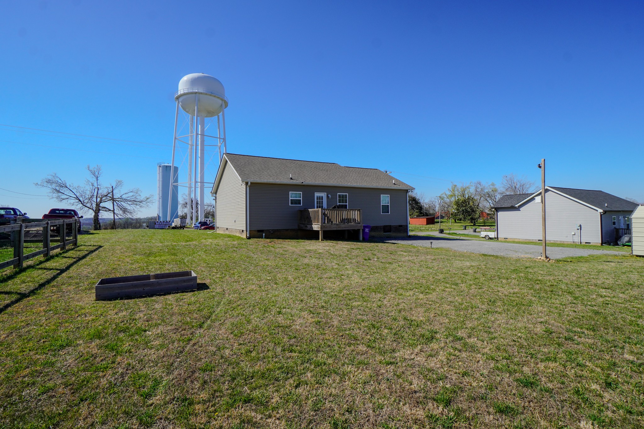 451 James Whitefield Road Bethpage, TN 37022 - Photo 6 of 52 a front view of a house with a garden and yard