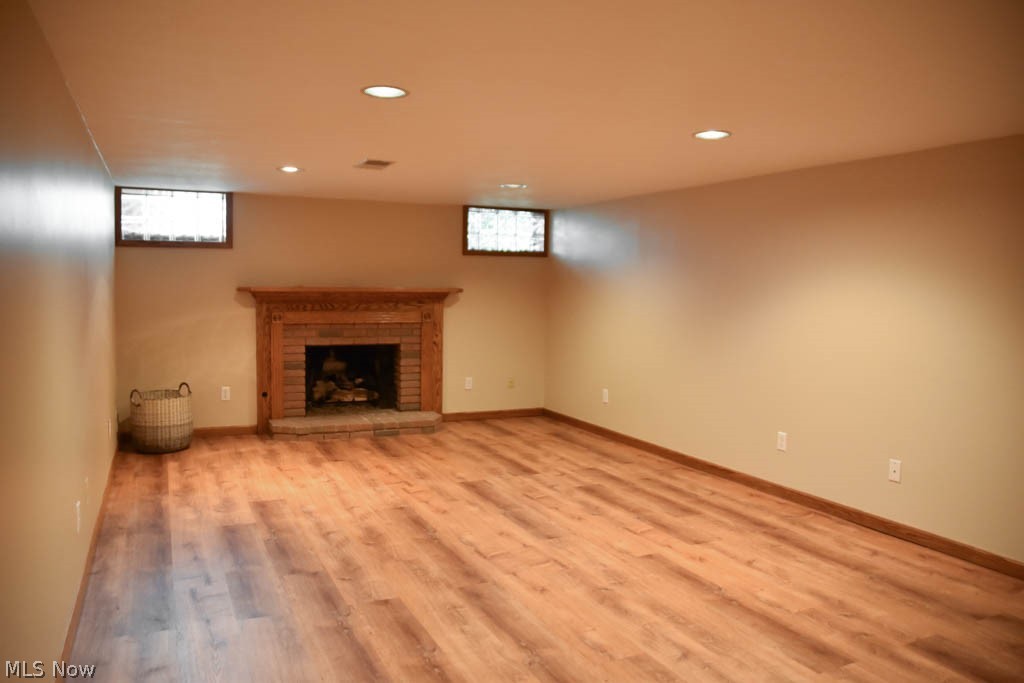 306 Everhard Road Southwest North Canton, OH 44709 - Photo 18 of 35 Family room with a fireplace on the lower level.